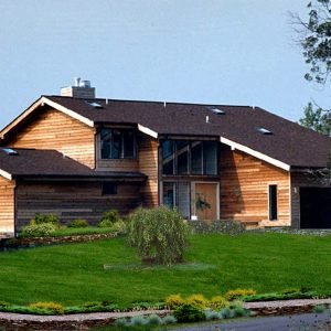 Chesapeake kit home rendering with wood siding and landscaped front yard